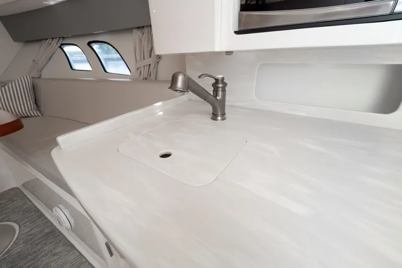  Yacht Photos Pics Interior of 2016 Intrepid 400 Cuddy featuring sleek countertop and modern faucet design.