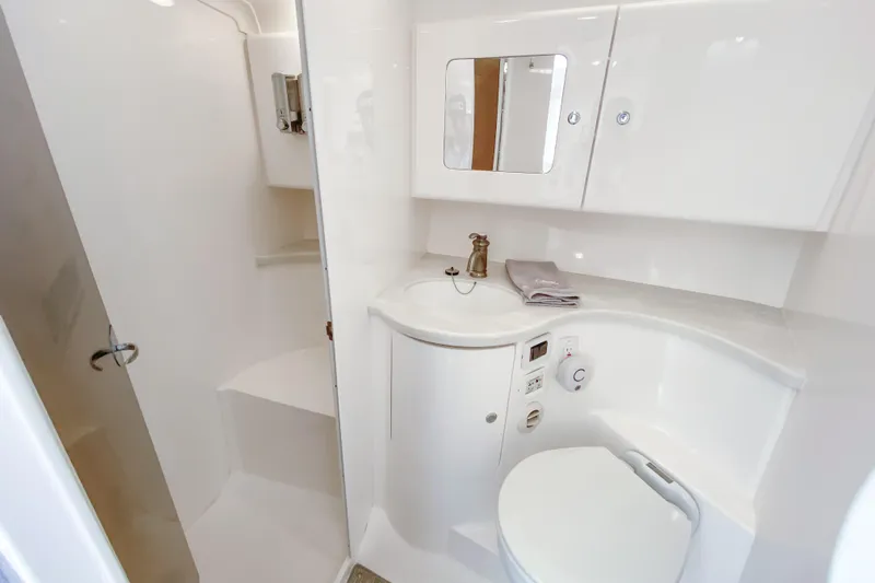  Yacht Photos Pics Luxurious bathroom interior of 2016 Intrepid 400 Cuddy boat, featuring modern fixtures and cabinetry.