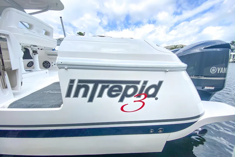  Yacht Photos Pics 2016 Intrepid 400 Cuddy boat with Yamaha engine, docked on a sunny day.