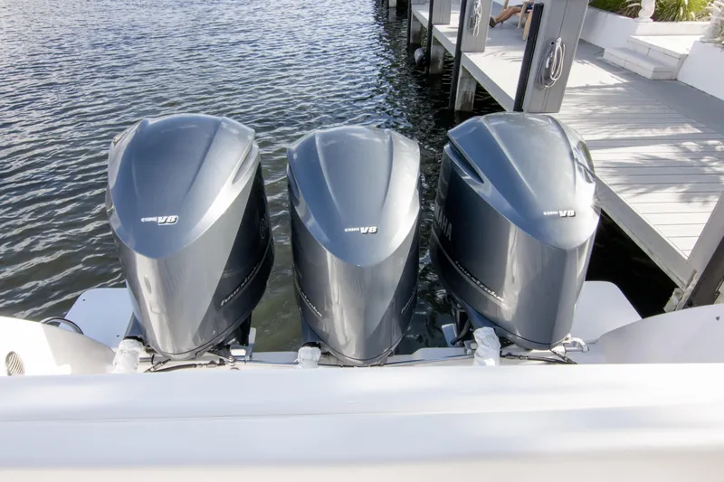  Yacht Photos Pics Triple Yamaha V8 engines on a 2016 Intrepid 400 Cuddy boat docked by the water.