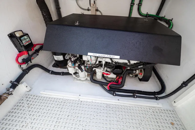  Yacht Photos Pics Engine compartment of a 2016 Intrepid 400 Cuddy boat, showcasing mechanical components.