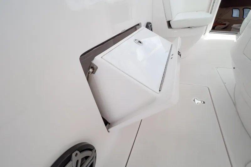  Yacht Photos Pics 2016 Intrepid 400 Cuddy interior with storage compartment and seating.