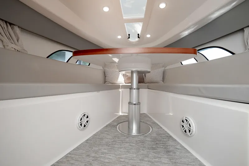  Yacht Photos Pics Interior of 2016 Intrepid 400 Cuddy boat with modern seating and table.