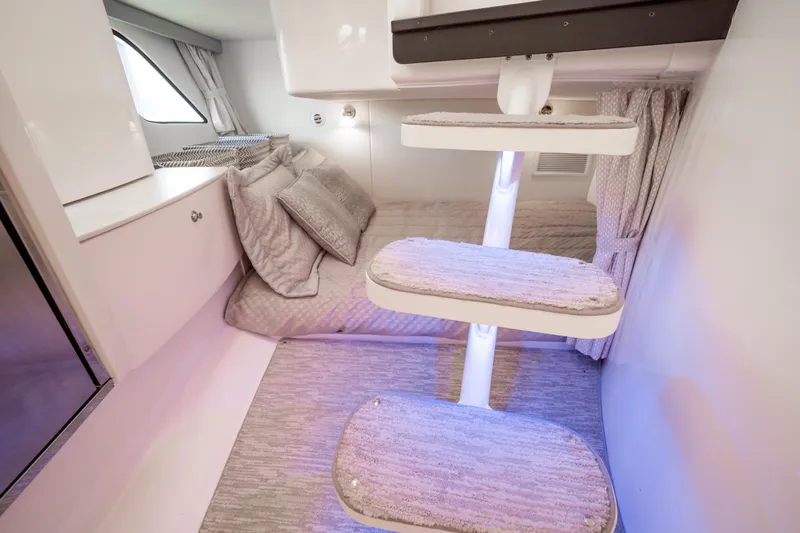  Yacht Photos Pics Interior of 2016 Intrepid 400 Cuddy, featuring cozy bedding and modern design elements.