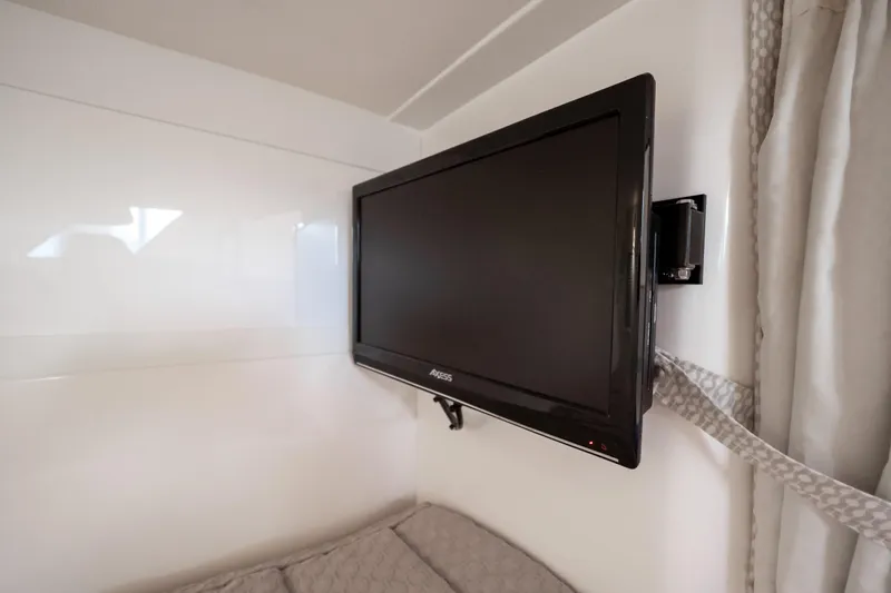  Yacht Photos Pics Flat-screen TV mounted in 2016 Intrepid 400 Cuddy cabin interior.