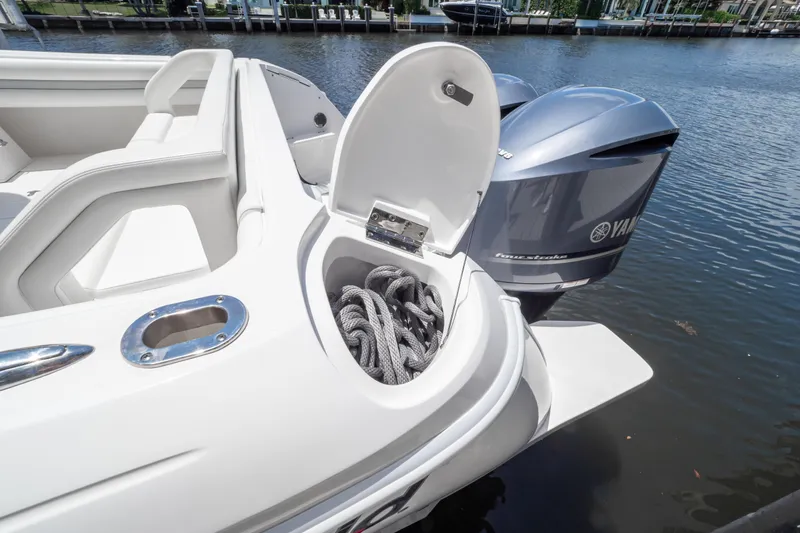  Yacht Photos Pics 2016 Intrepid 400 Cuddy boat with open storage compartment and Yamaha outboard engines.