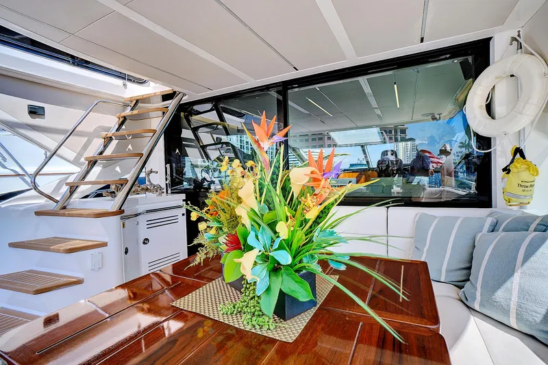 Once Around Yacht Photos Pics Luxurious interior of 2017 Sunseeker 68 Sport Yacht with elegant floral arrangement.