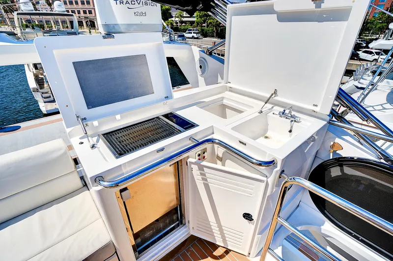 Once Around Yacht Photos Pics Outdoor kitchen area on 2017 Sunseeker 68 Sport Yacht with grill and sink.