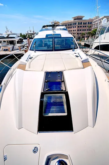 Once Around Yacht Photos Pics 2017 Sunseeker 68 Sport Yacht docked at a marina.
