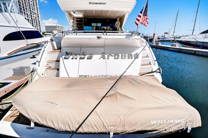 Once Around Yacht Photos Pics 2017 Sunseeker 68 Sport Yacht docked at marina with American flag.
