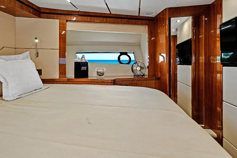 Once Around Yacht Photos Pics Luxurious bedroom interior of 2017 Sunseeker 68 Sport Yacht with wooden finishes.