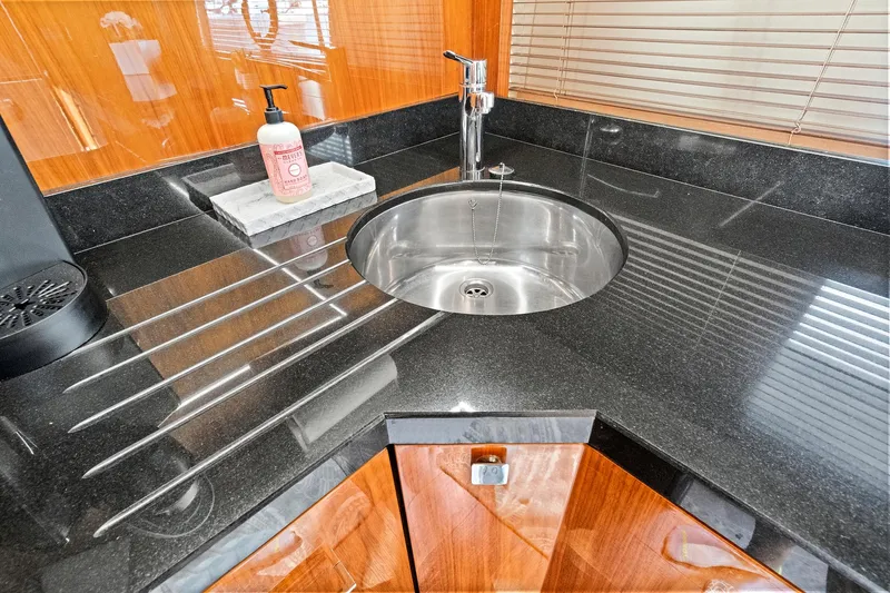 Once Around Yacht Photos Pics Modern kitchen sink in 2017 Sunseeker 68 Sport Yacht with sleek black countertop.