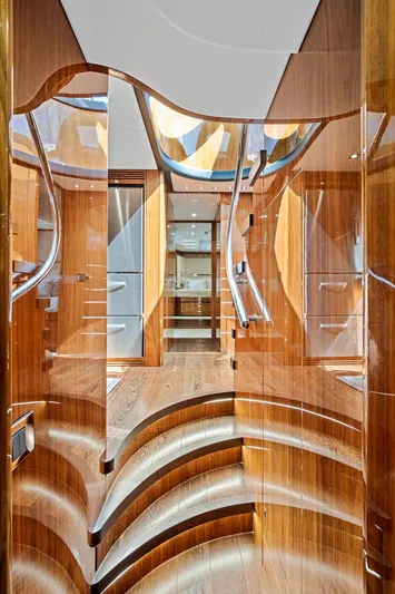 Once Around Yacht Photos Pics Interior of 2017 Sunseeker 68 Sport Yacht with polished wooden stairs and modern design.