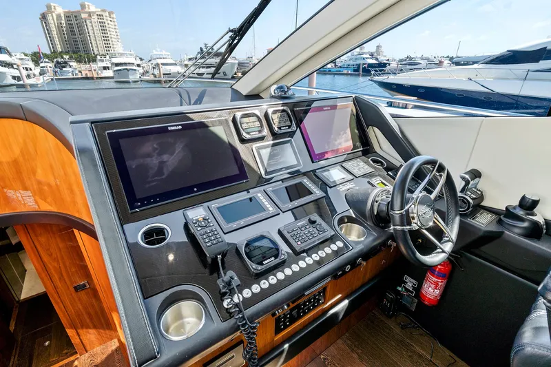 Once Around Yacht Photos Pics 2017 Sunseeker 68 Sport Yacht helm with advanced navigation systems and luxurious design.