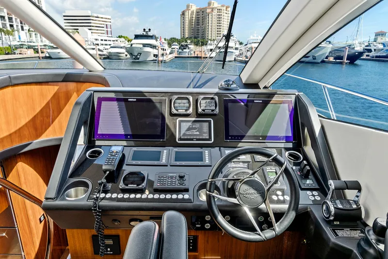 Once Around Yacht Photos Pics Cockpit of 2017 Sunseeker 68 Sport Yacht with modern navigation equipment.