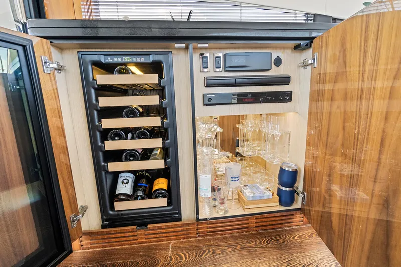 Once Around Yacht Photos Pics Wine and glass storage cabinet on 2017 Sunseeker 68 Sport Yacht.