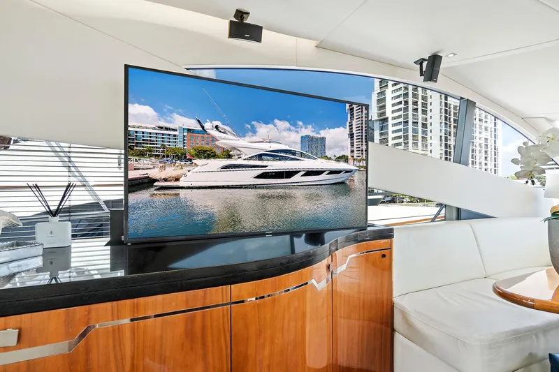 Once Around Yacht Photos Pics Interior of 2017 Sunseeker 68 Sport Yacht with TV and modern furnishings.