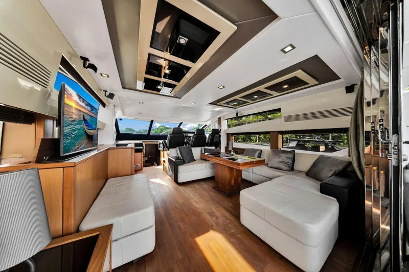 Jimbo Yacht Photos Pics Luxurious interior of 2012 Sunseeker 74 Sport Yacht with modern furnishings and large windows.