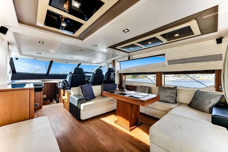 Jimbo Yacht Photos Pics Luxurious interior of 2012 Sunseeker 74 Sport Yacht with modern seating and panoramic windows.