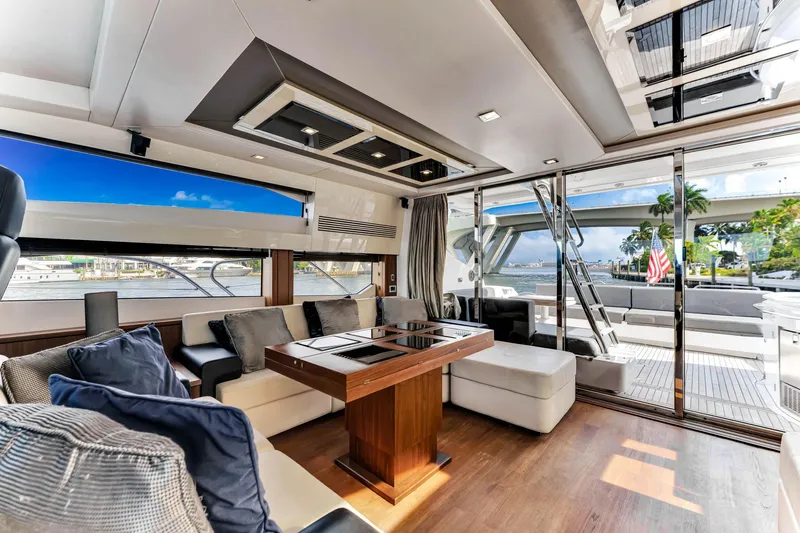 Jimbo Yacht Photos Pics Luxurious interior of 2012 Sunseeker 74 Sport Yacht with modern furnishings and ocean view.