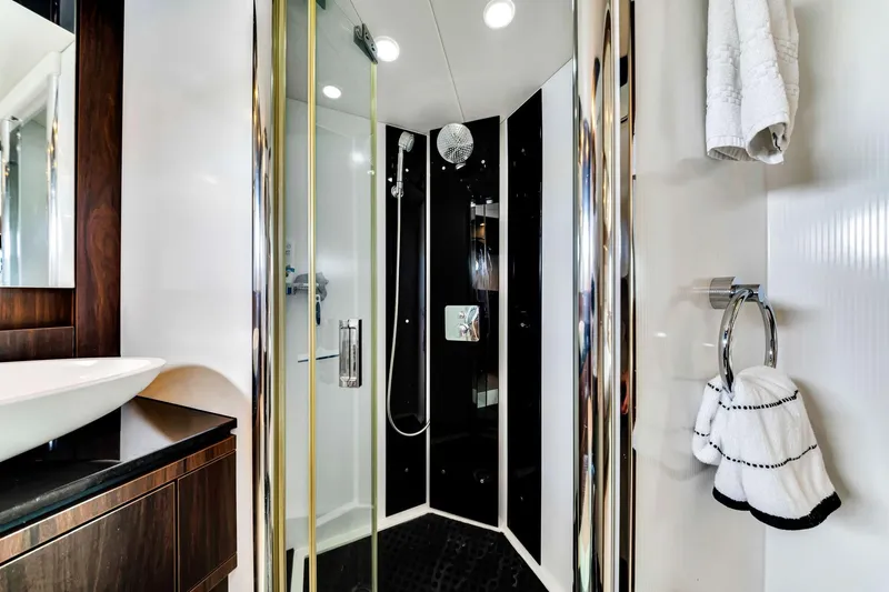 Jimbo Yacht Photos Pics Luxurious bathroom in 2012 Sunseeker 74 Sport Yacht with modern shower and elegant fixtures.