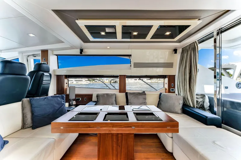 Jimbo Yacht Photos Pics Luxurious interior of 2012 Sunseeker 74 Sport Yacht with elegant seating and modern design.