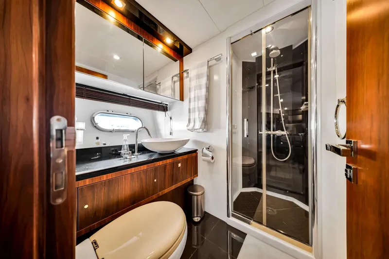 Jimbo Yacht Photos Pics Luxurious bathroom in 2012 Sunseeker 74 Sport Yacht with modern fixtures and shower.