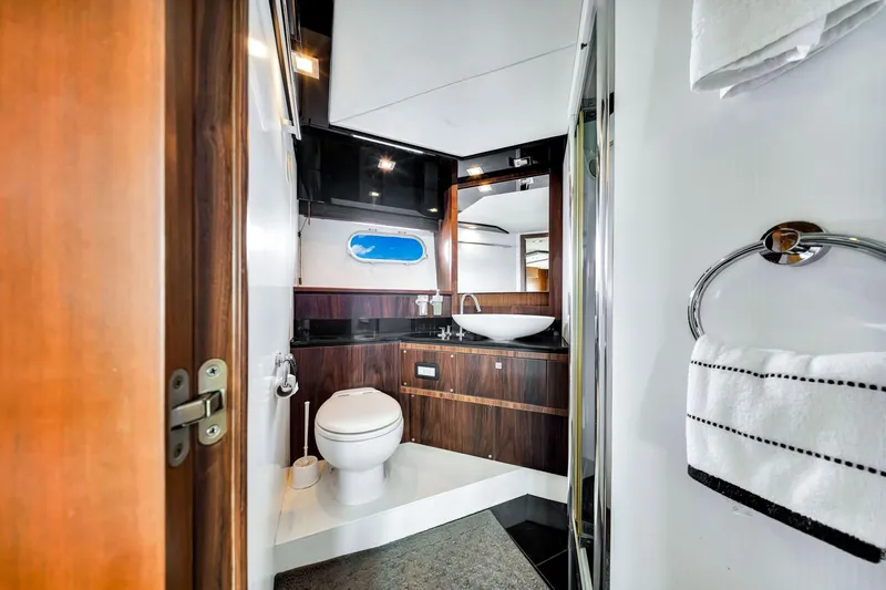 Jimbo Yacht Photos Pics Luxurious bathroom in 2012 Sunseeker 74 Sport Yacht with modern fixtures and elegant design.