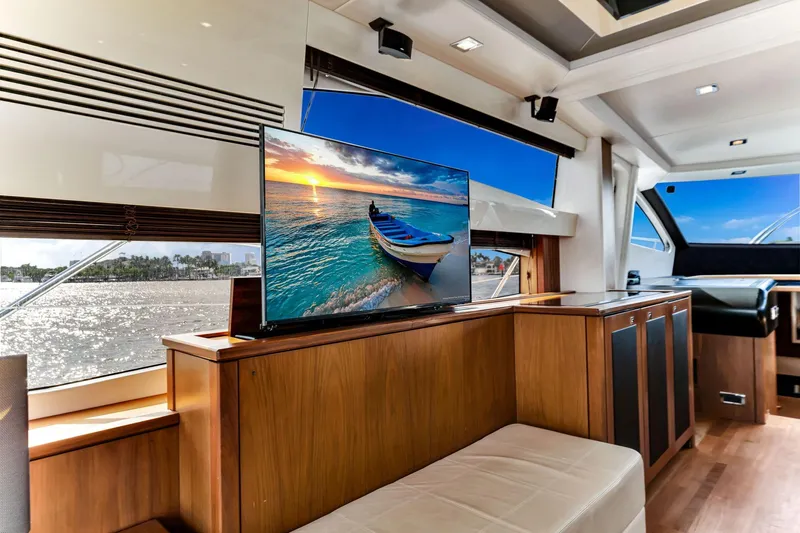 Jimbo Yacht Photos Pics Luxurious interior of 2012 Sunseeker 74 Sport Yacht with scenic view on TV.