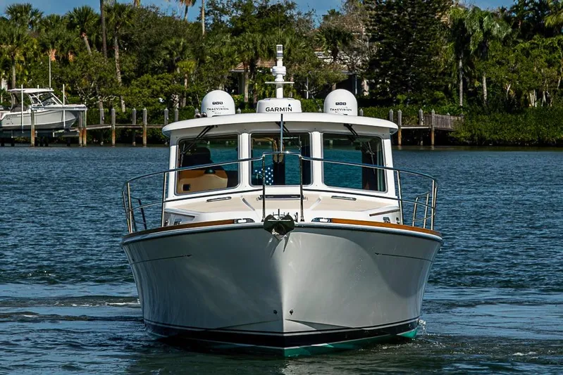  Yacht Photos Pics 2016 Sabre 42 Salon Express yacht cruising on a serene waterway.