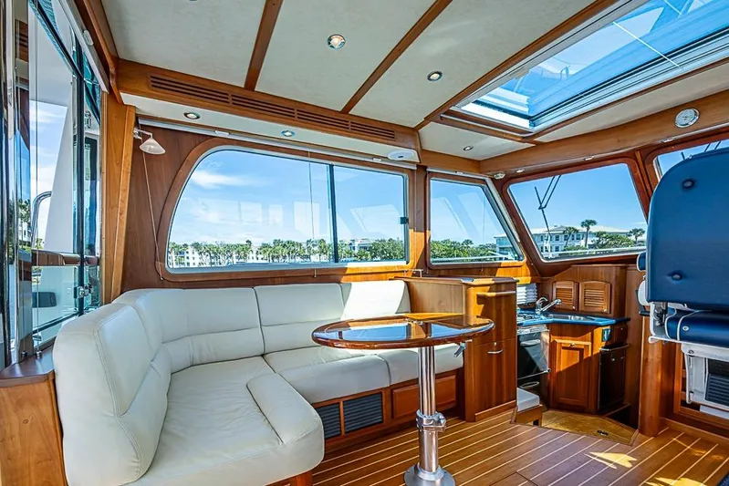  Yacht Photos Pics Luxurious interior of 2016 Sabre 42 Salon Express yacht with leather seating and panoramic windows.