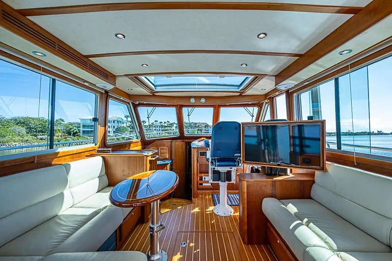  Yacht Photos Pics Luxurious interior of 2016 Sabre 42 Salon Express yacht with panoramic windows and elegant furnishings.