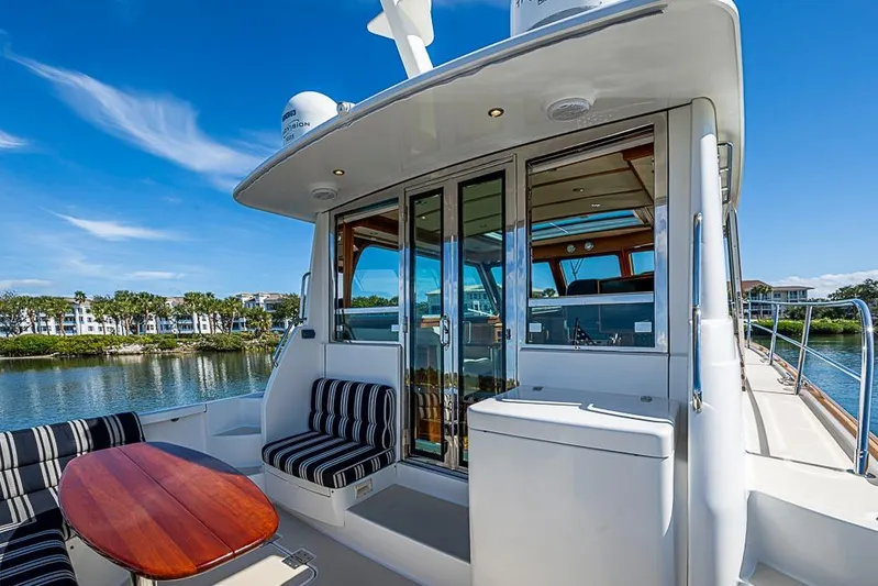  Yacht Photos Pics 2016 Sabre 42 Salon Express yacht with elegant seating and scenic water view.