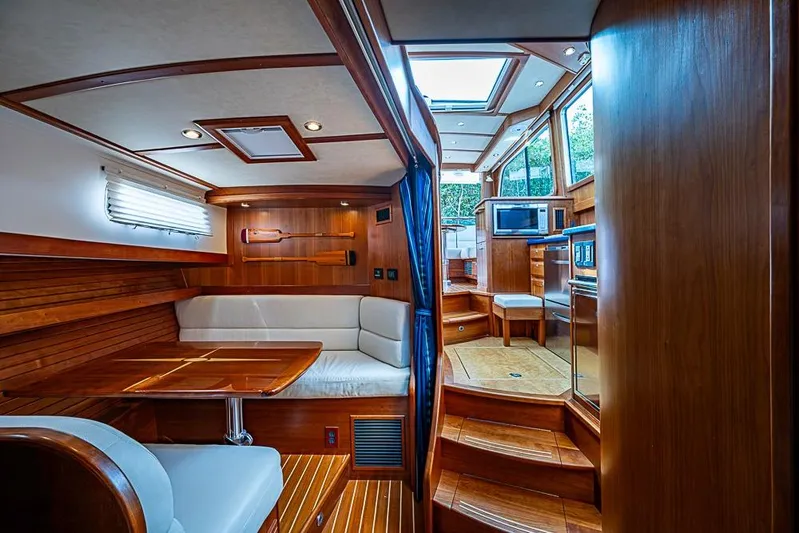  Yacht Photos Pics Interior of 2016 Sabre 42 Salon Express yacht with wood finish and modern amenities.