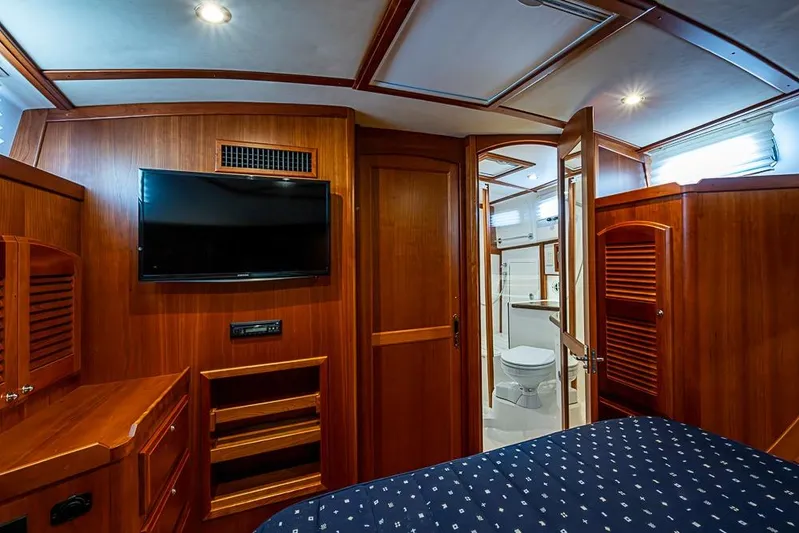  Yacht Photos Pics Luxurious interior of 2016 Sabre 42 Salon Express yacht with wood paneling and modern amenities.
