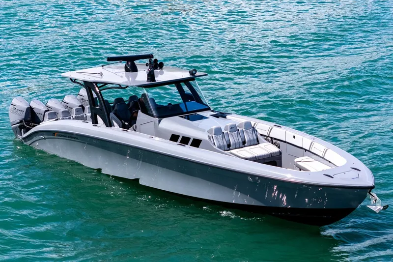  Yacht Photos Pics 2023 Midnight Express 43 Solstice boat cruising on clear blue water.