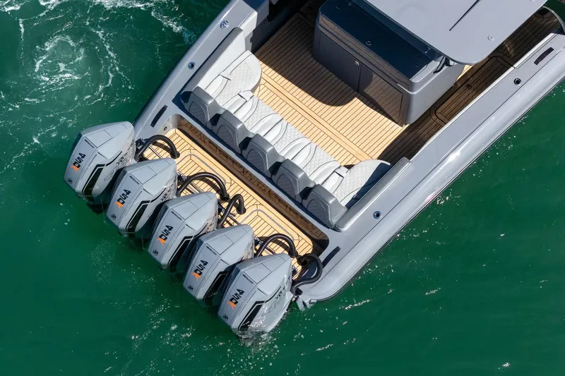  Yacht Photos Pics 2023 Midnight Express 43 Solstice boat with five powerful outboard engines on turquoise water.