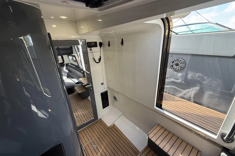  Yacht Photos Pics Interior view of 2023 Midnight Express 43 Solstice yacht, featuring sleek design and wood flooring.