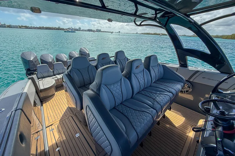  Yacht Photos Pics Luxurious interior of 2023 Midnight Express 43 Solstice boat on serene water.