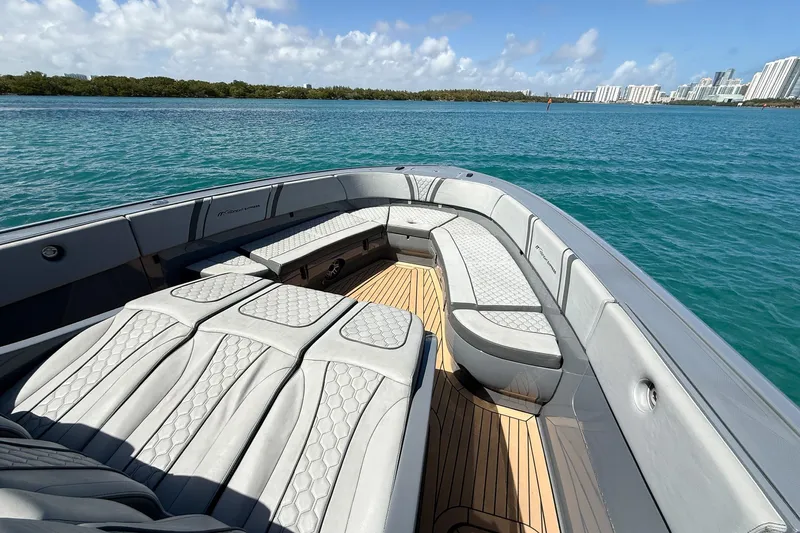  Yacht Photos Pics Luxury seating on 2023 Midnight Express 43 Solstice boat, cruising on clear blue waters.