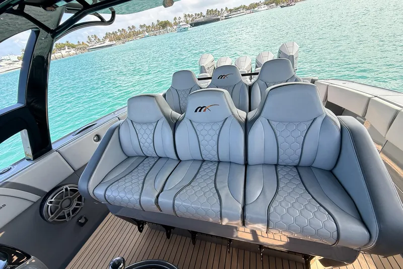  Yacht Photos Pics Luxurious seating on 2023 Midnight Express 43 Solstice boat with scenic ocean view.