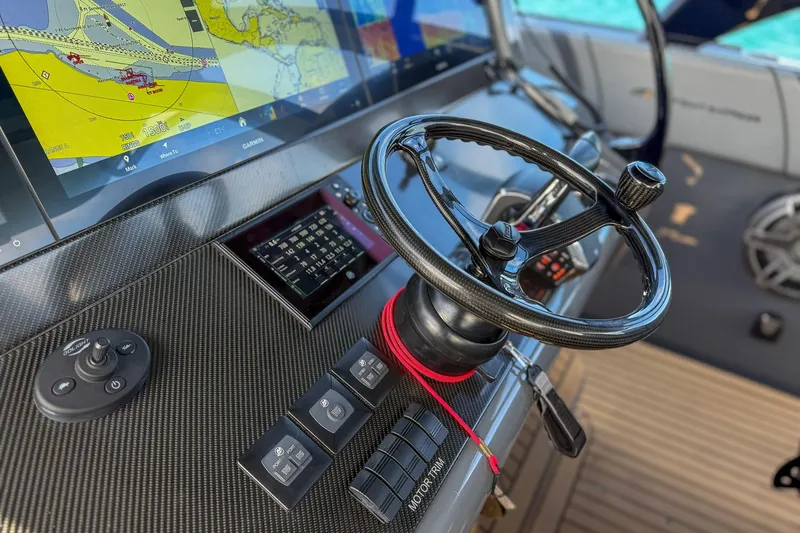  Yacht Photos Pics Steering console of 2023 Midnight Express 43 Solstice boat with navigation display.