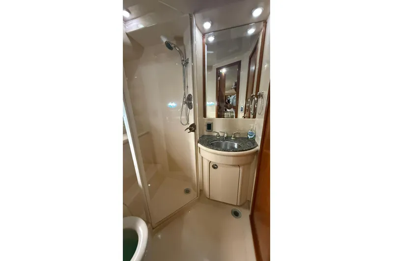  Yacht Photos Pics Luxurious bathroom in 2004 Meridian 459 Motoryacht with shower and sink.