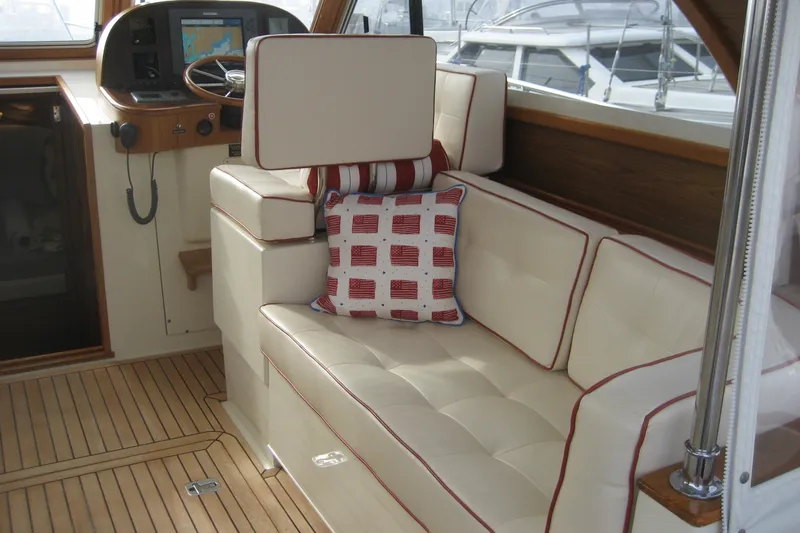 Off Islander Yacht Photos Pics Luxurious interior of 2007 Legacy Yachts 32 with plush seating and nautical decor.
