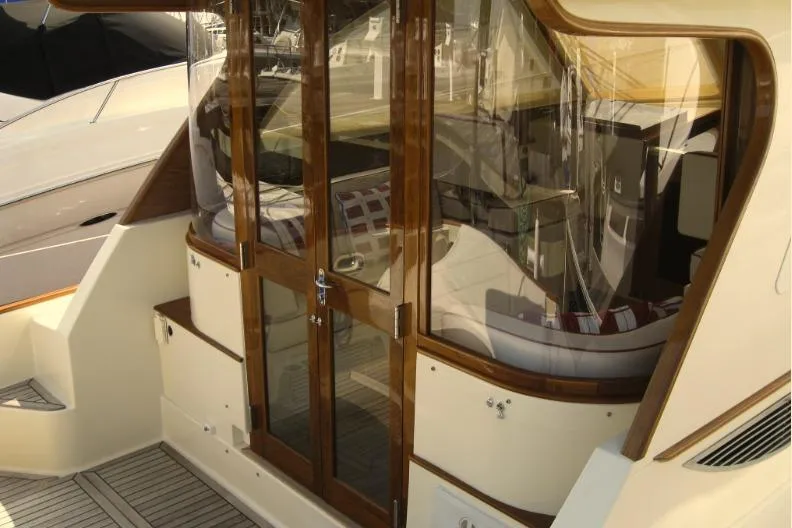 Off Islander Yacht Photos Pics 2007 Legacy Yachts 32 with wooden doors and elegant interior design.