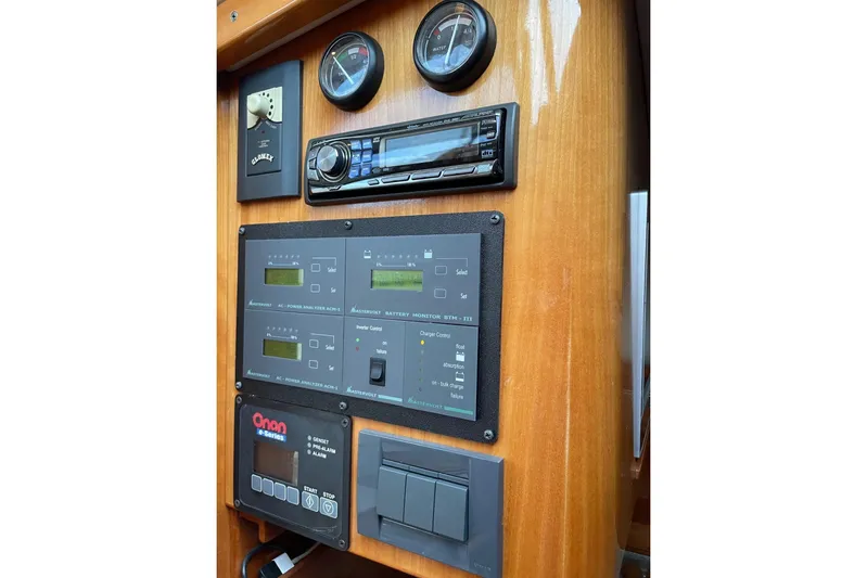 Off Islander Yacht Photos Pics Control panel of a 2007 Legacy Yachts 32, featuring gauges and electronic systems.