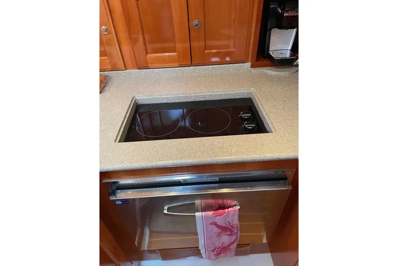Off Islander Yacht Photos Pics Modern yacht kitchen with electric cooktop and oven, Legacy Yachts 32, 2007 model.