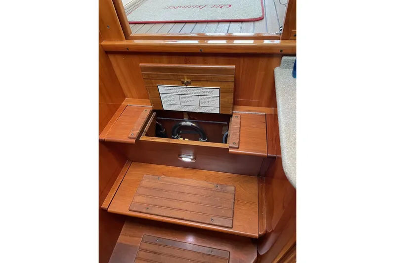 Off Islander Yacht Photos Pics Interior view of 2007 Legacy Yachts 32, showcasing wooden steps and storage compartment.
