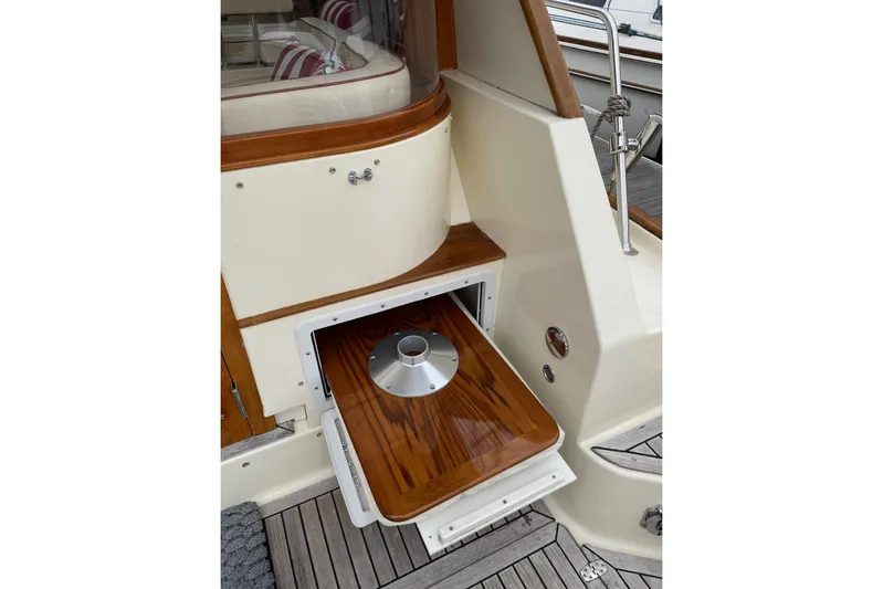 Off Islander Yacht Photos Pics 2007 Legacy Yachts 32, wooden deck detail with storage compartment open.
