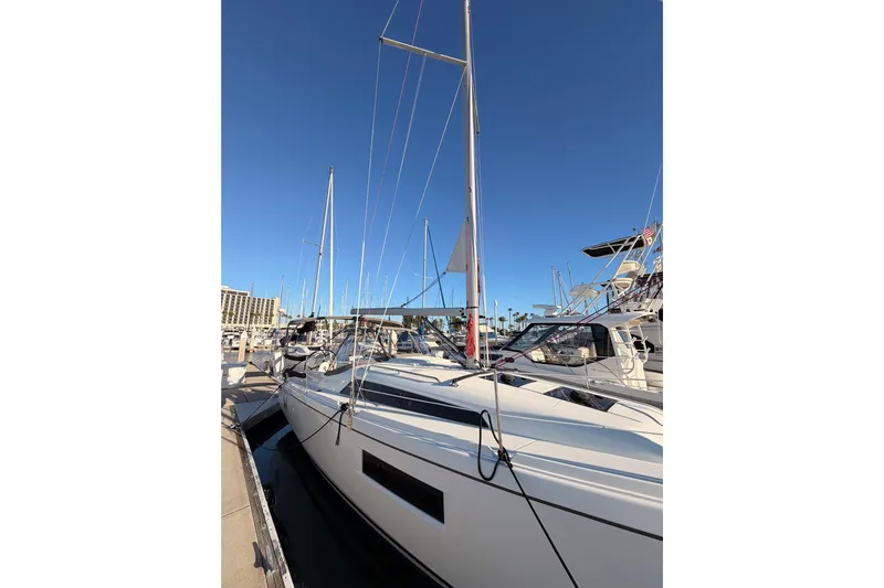  Yacht Photos Pics 2020 Beneteau Oceanis 30.1 sailboat docked at marina under clear blue sky.